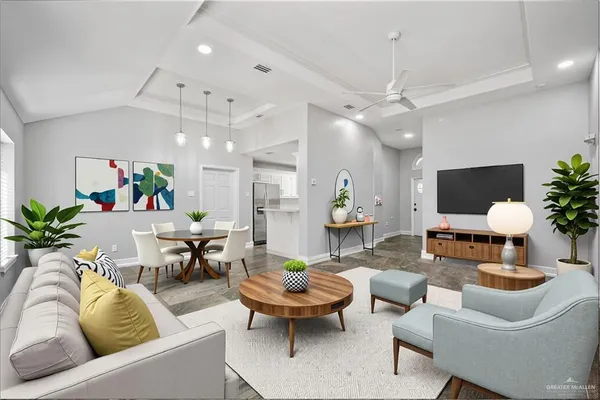 a living room with furniture potted plant and a chandelier