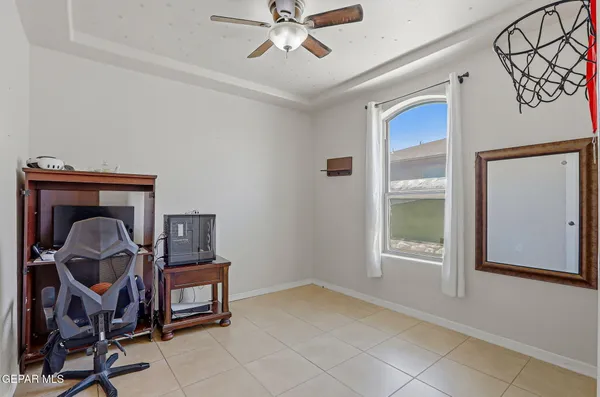 a view of room with workspace and windows