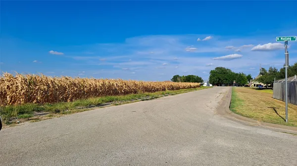 a view of a road with a yard