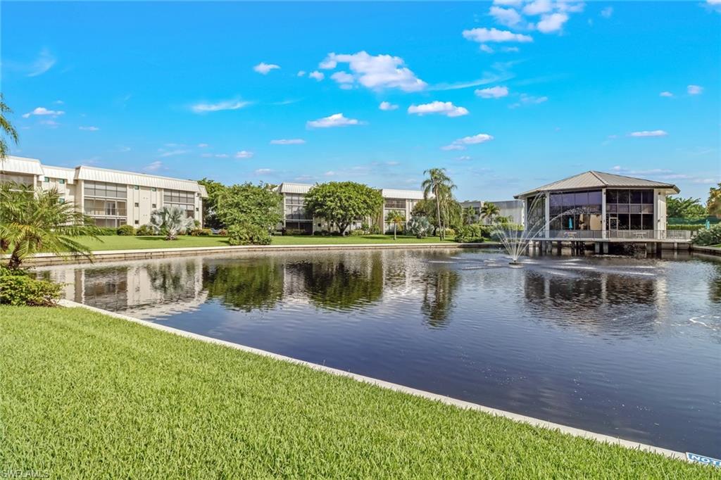 788 Park Shore Drive, Unit E32 Naples, FL 34103 - Photo 26 of 35 a view of a lake with houses