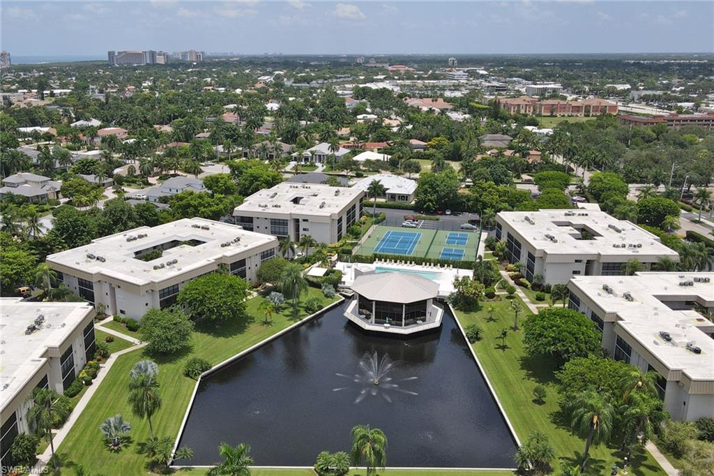 788 Park Shore Drive, Unit E32 Naples, FL 34103 - Photo 30 of 35 an aerial view of a house with lawn chairs