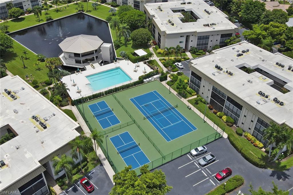 788 Park Shore Drive, Unit E32 Naples, FL 34103 - Photo 31 of 35 an aerial view of a house with garden space and street view