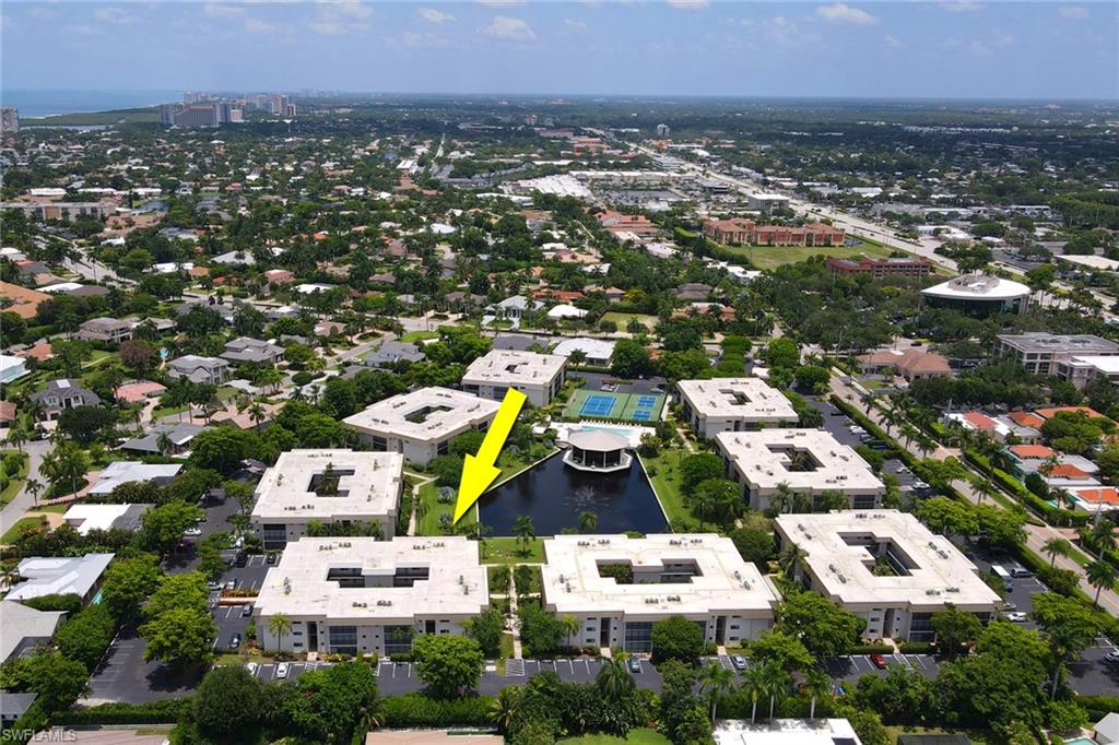 788 Park Shore Drive, Unit E32 Naples, FL 34103 - Photo 34 of 35 an aerial view of residential houses with city view