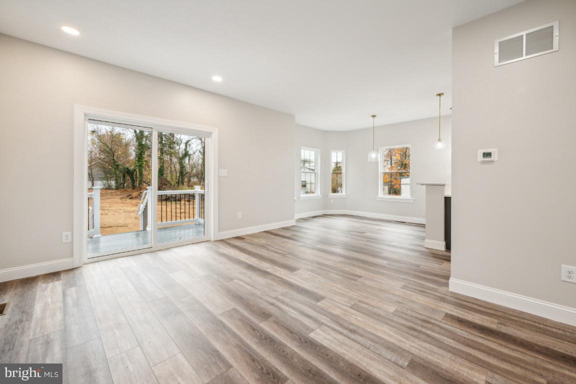 459 Berkley Road Mantua, NJ 08051 - Photo 12 of 28 a view of an empty room with wooden floor and a window