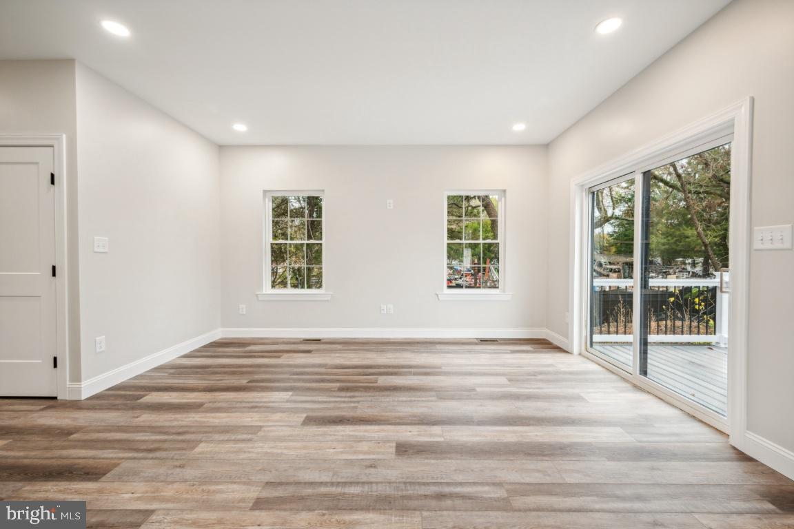 459 Berkley Road Mantua, NJ 08051 - Photo 13 of 28 a view of an empty room with wooden floor and a window
