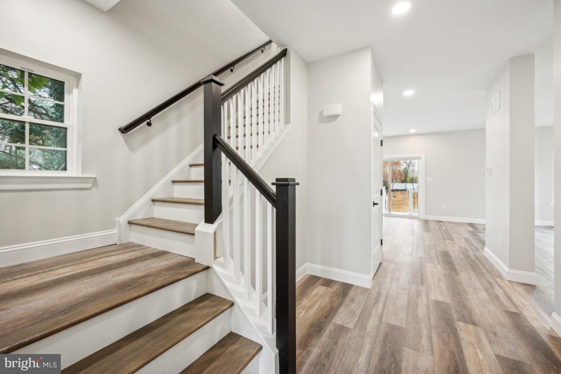 459 Berkley Road Mantua, NJ 08051 - Photo 15 of 28 a view of a hallway with wooden floor and staircase