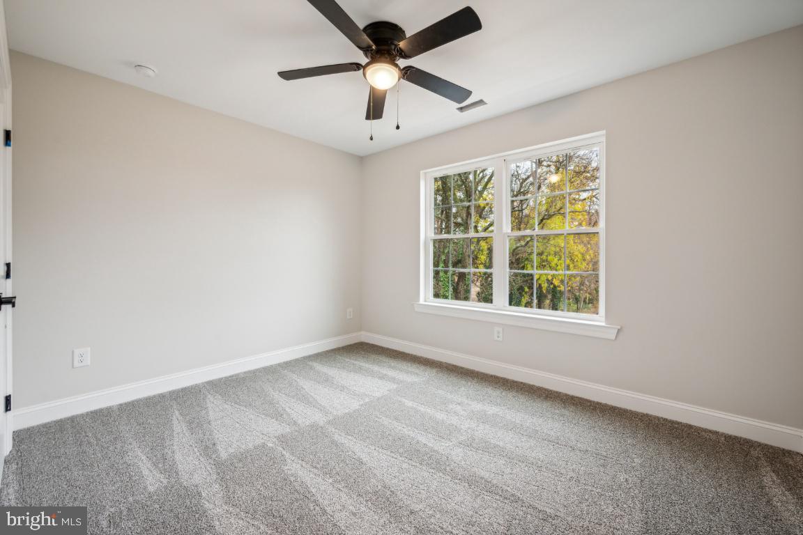 459 Berkley Road Mantua, NJ 08051 - Photo 20 of 28 an empty room with a window and a fan