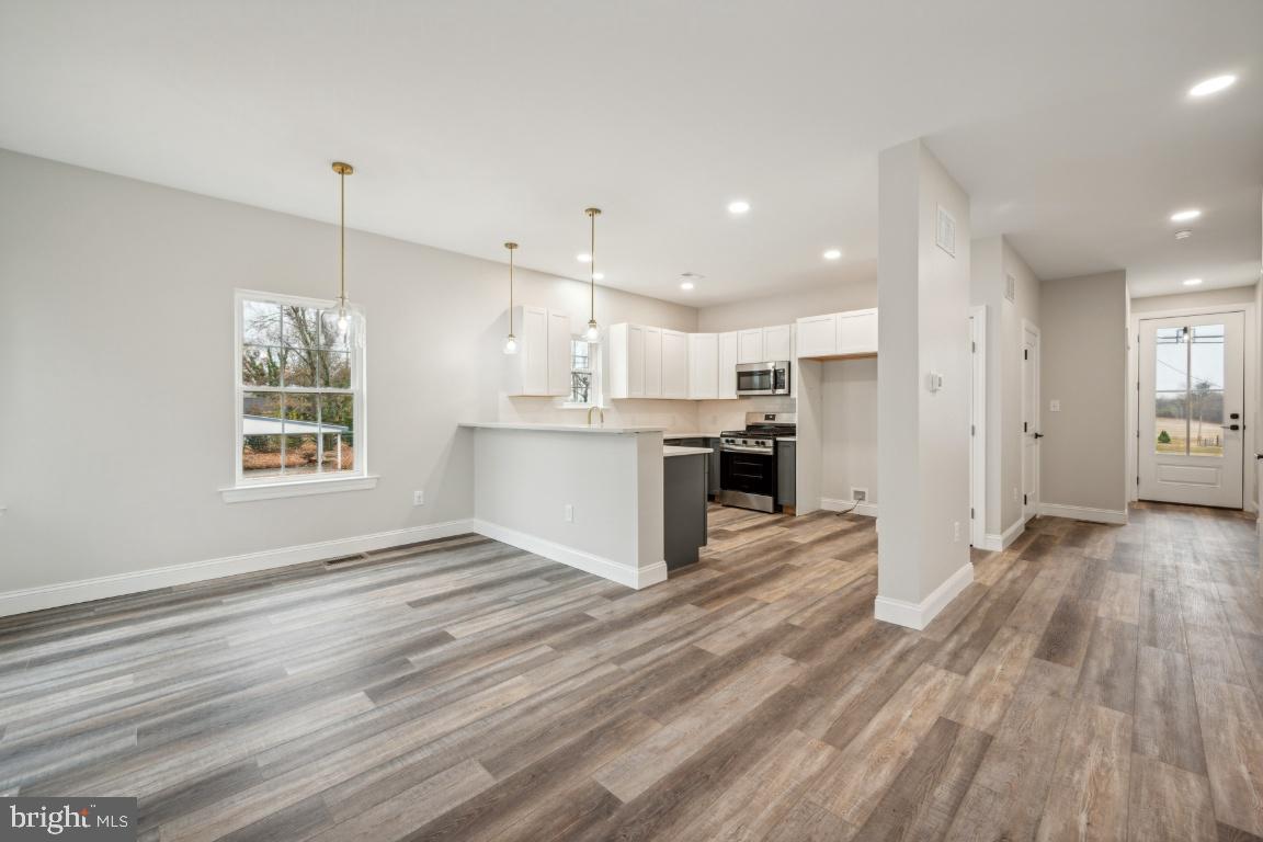 459 Berkley Road Mantua, NJ 08051 - Photo 7 of 28 a view of kitchen with refrigerator microwave and stove
