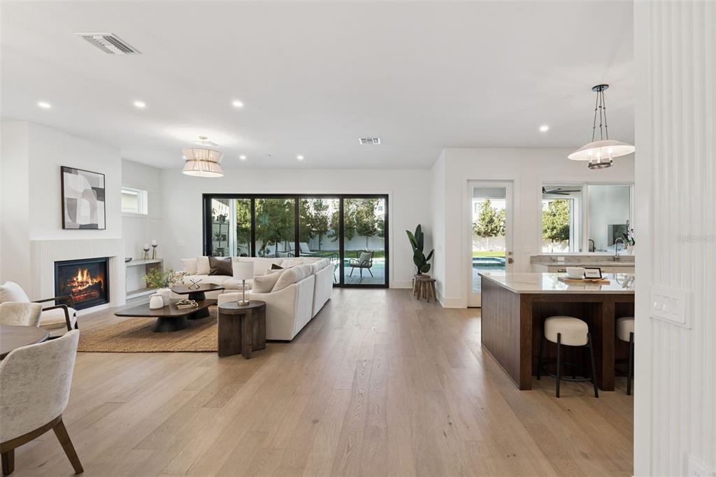 35 West Hazel Street Orlando, FL 32804 - Photo 12 of 60 a living room with furniture and a fireplace