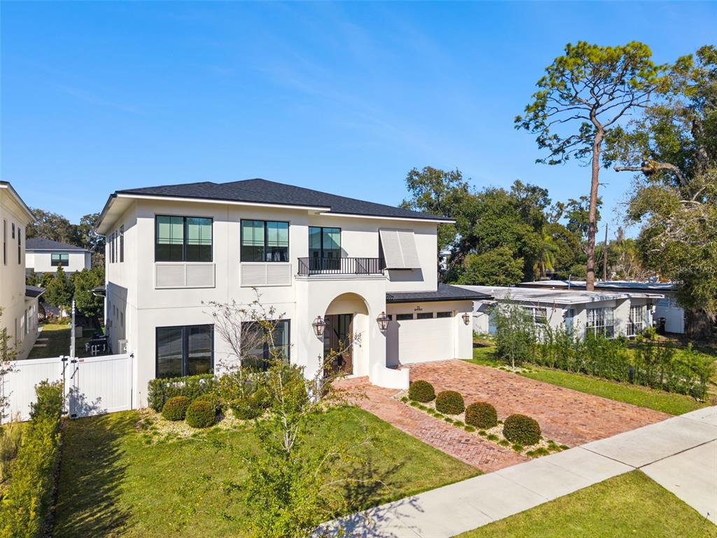 35 West Hazel Street Orlando, FL 32804 - Photo 2 of 60 a front view of a house with swimming pool