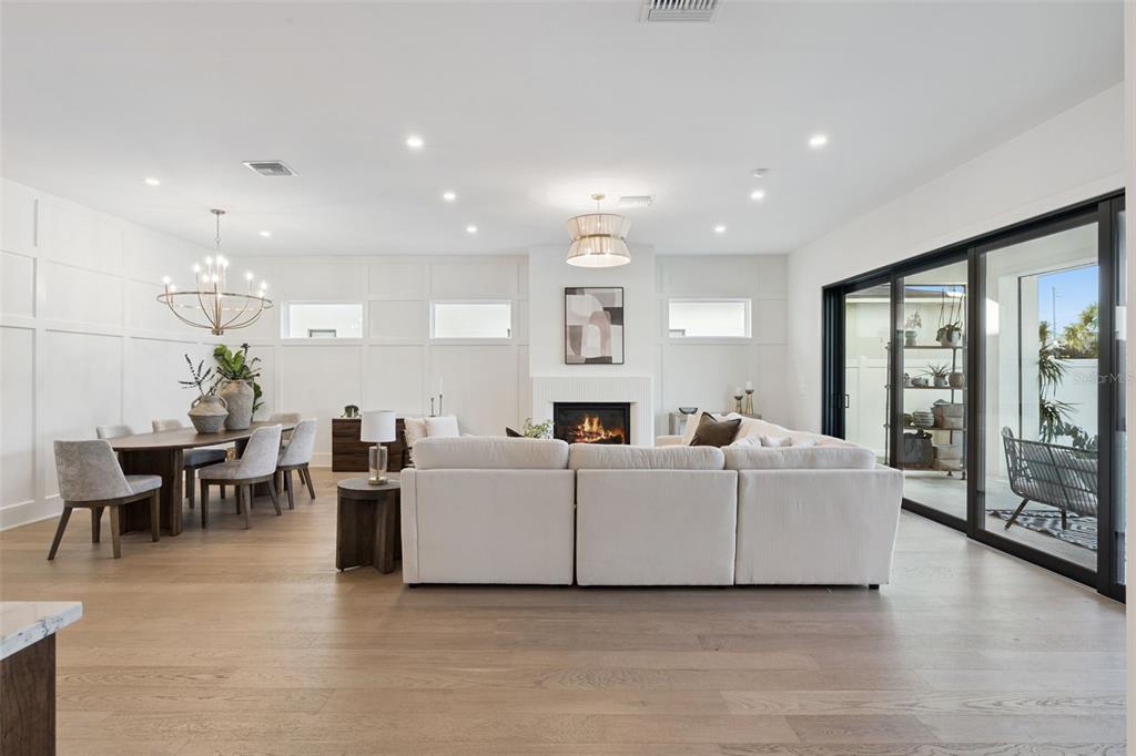 35 West Hazel Street Orlando, FL 32804 - Photo 21 of 60 a living room with furniture a large window and a fireplace