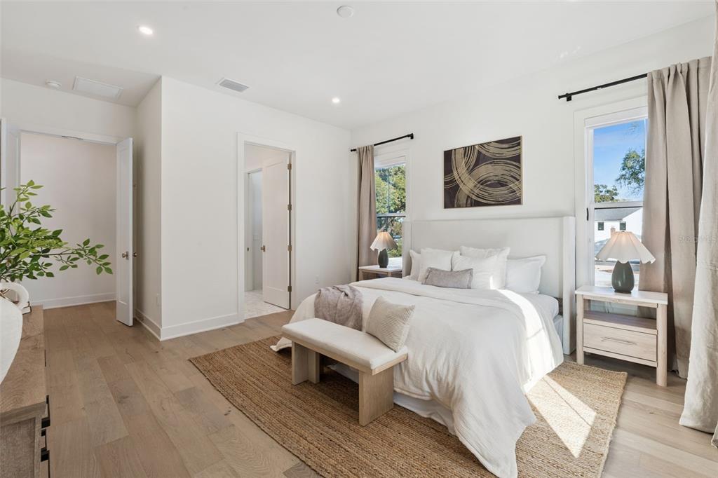 35 West Hazel Street Orlando, FL 32804 - Photo 28 of 60 a bedroom with a bed and a couch