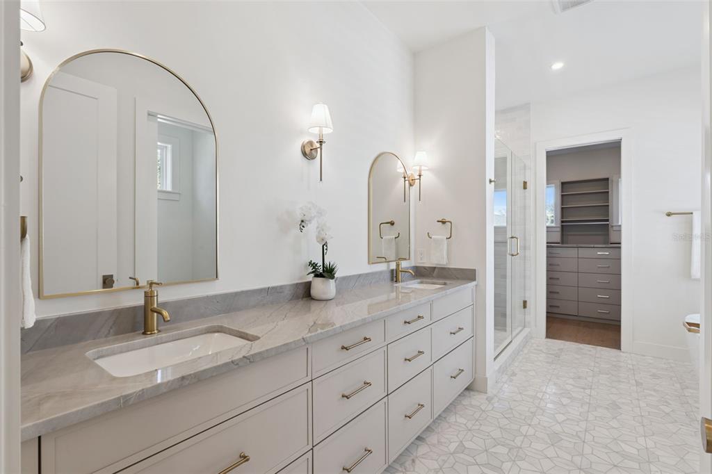 35 West Hazel Street Orlando, FL 32804 - Photo 31 of 60 a bathroom with a granite countertop double vanity sink and a mirror