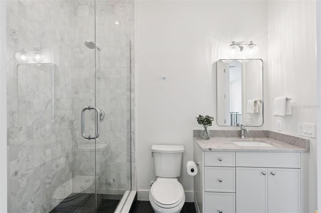 35 West Hazel Street Orlando, FL 32804 - Photo 39 of 60 a bathroom with a sink a toilet and shower