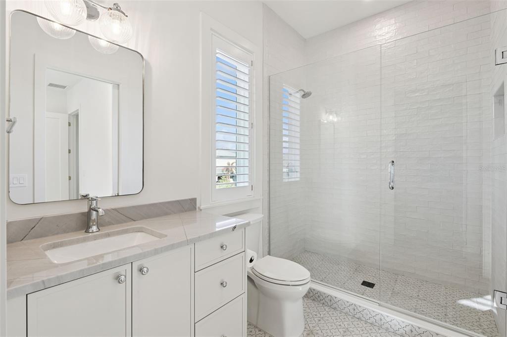 35 West Hazel Street Orlando, FL 32804 - Photo 45 of 60 a bathroom with a double vanity sink toilet and shower