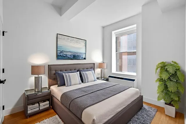 a kitchen with stainless steel appliances a sink a stove and a microwave