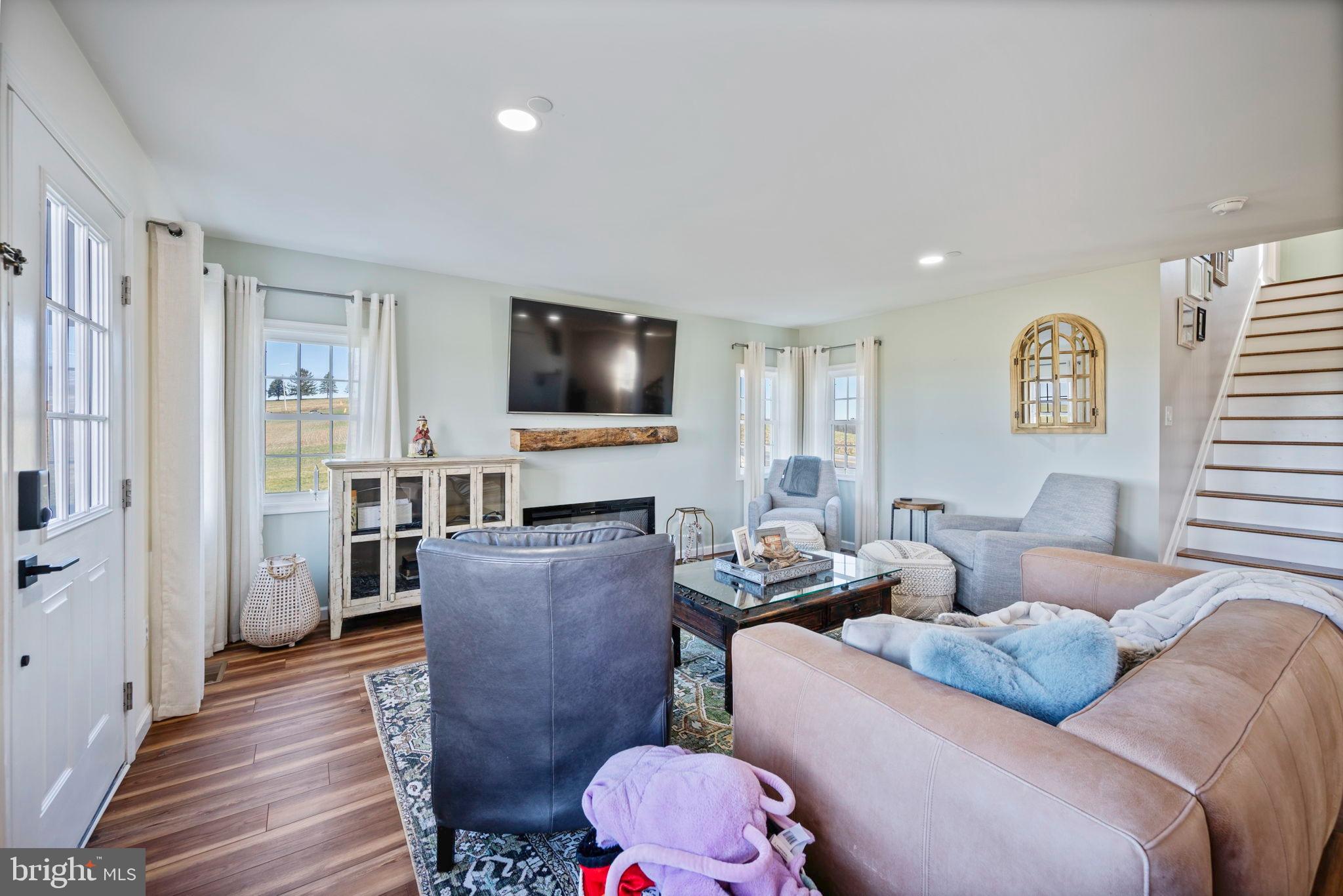118 South Clear Ridge Road New Windsor, MD 21776 - Photo 12 of 44 a living room with furniture and a flat screen tv