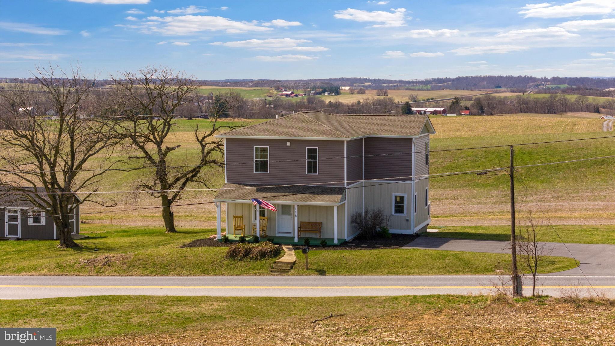 118 South Clear Ridge Road New Windsor, MD 21776 - Photo 2 of 44 a view of a house with a ocean view
