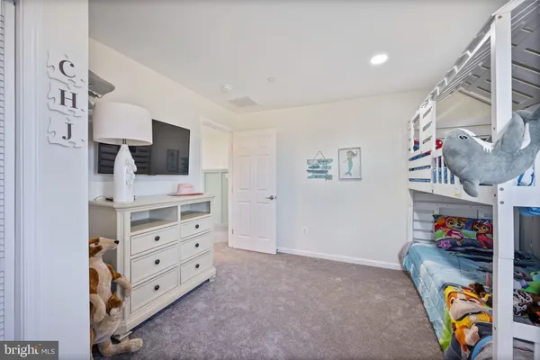 a room with furniture and a flat screen tv