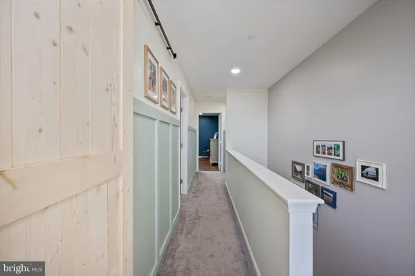 a view of a hallway with windows