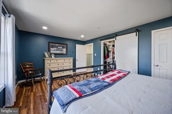 a bedroom with a bed and furniture