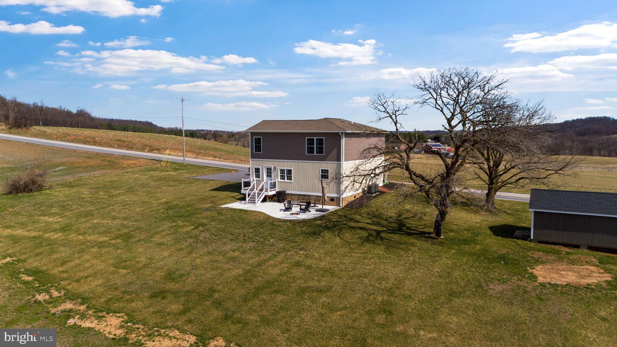 118 South Clear Ridge Road New Windsor, MD 21776 - Photo 3 of 44 a view of a lake with a yard