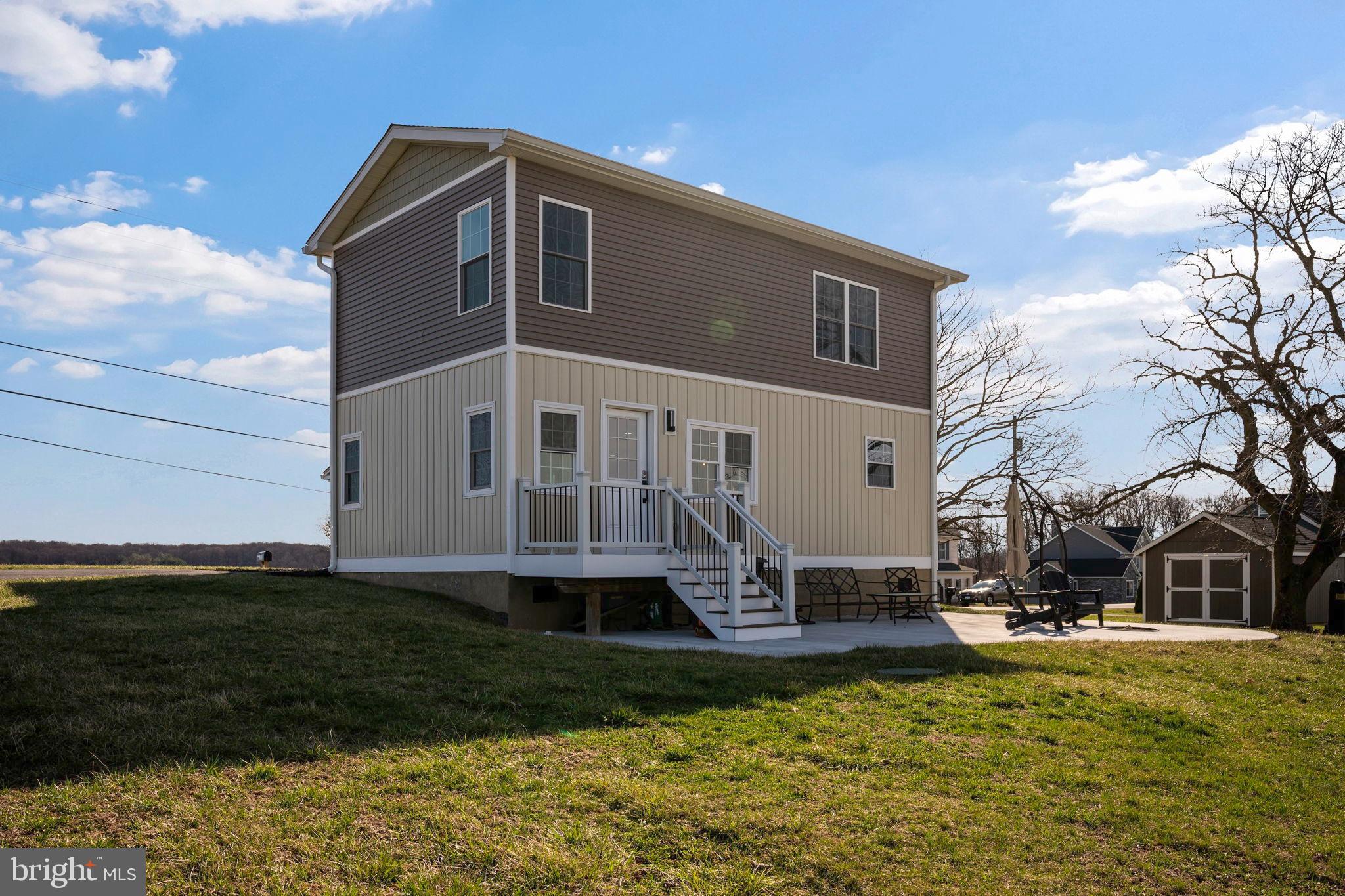 118 South Clear Ridge Road New Windsor, MD 21776 - Photo 34 of 44 a front view of a house with a yard
