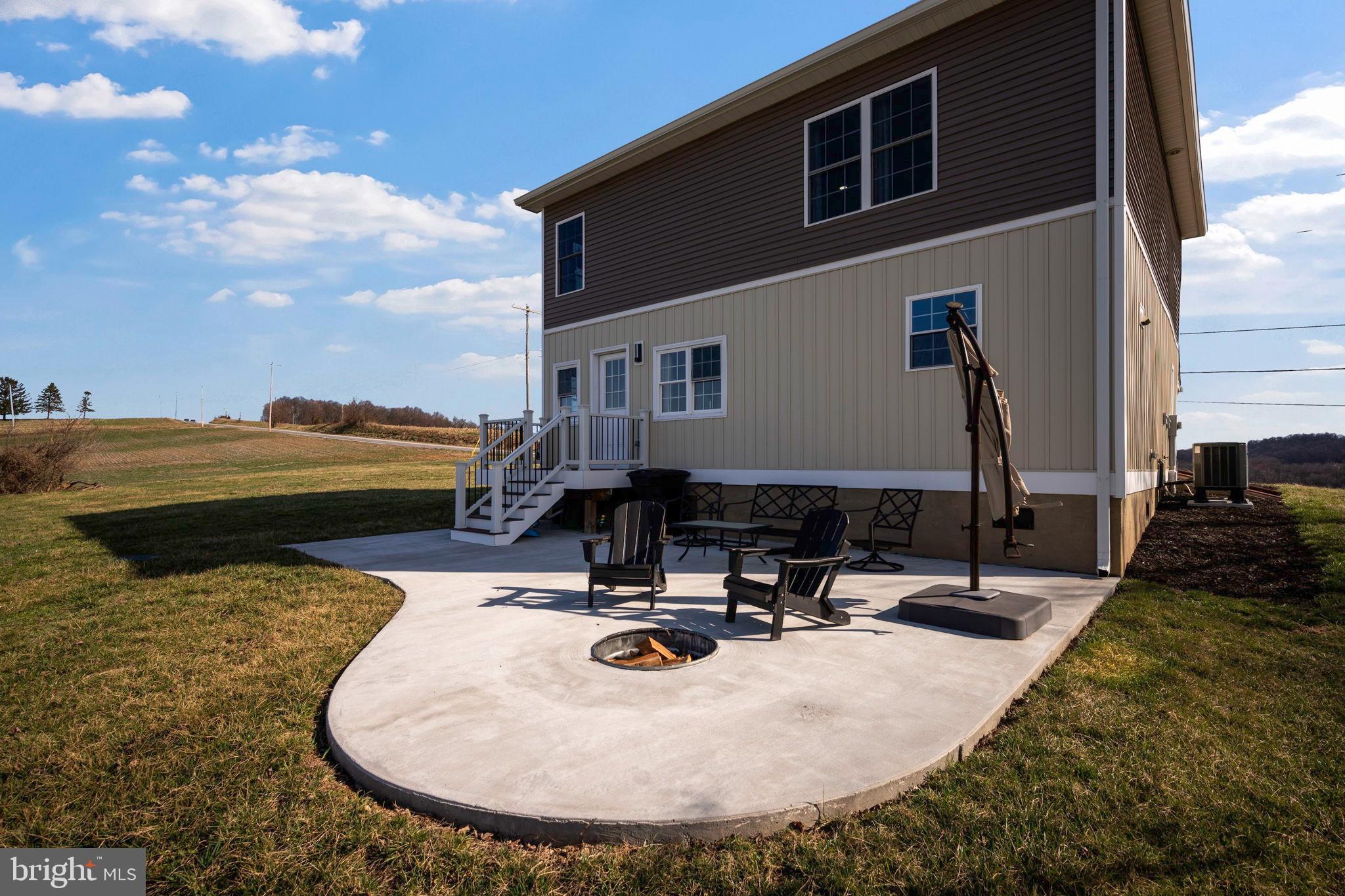 118 South Clear Ridge Road New Windsor, MD 21776 - Photo 37 of 44 a view of a house with swimming pool and sitting area