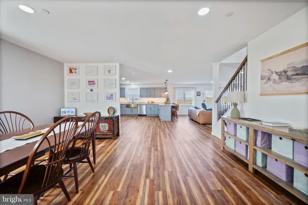 a living room with furniture and a book shelf