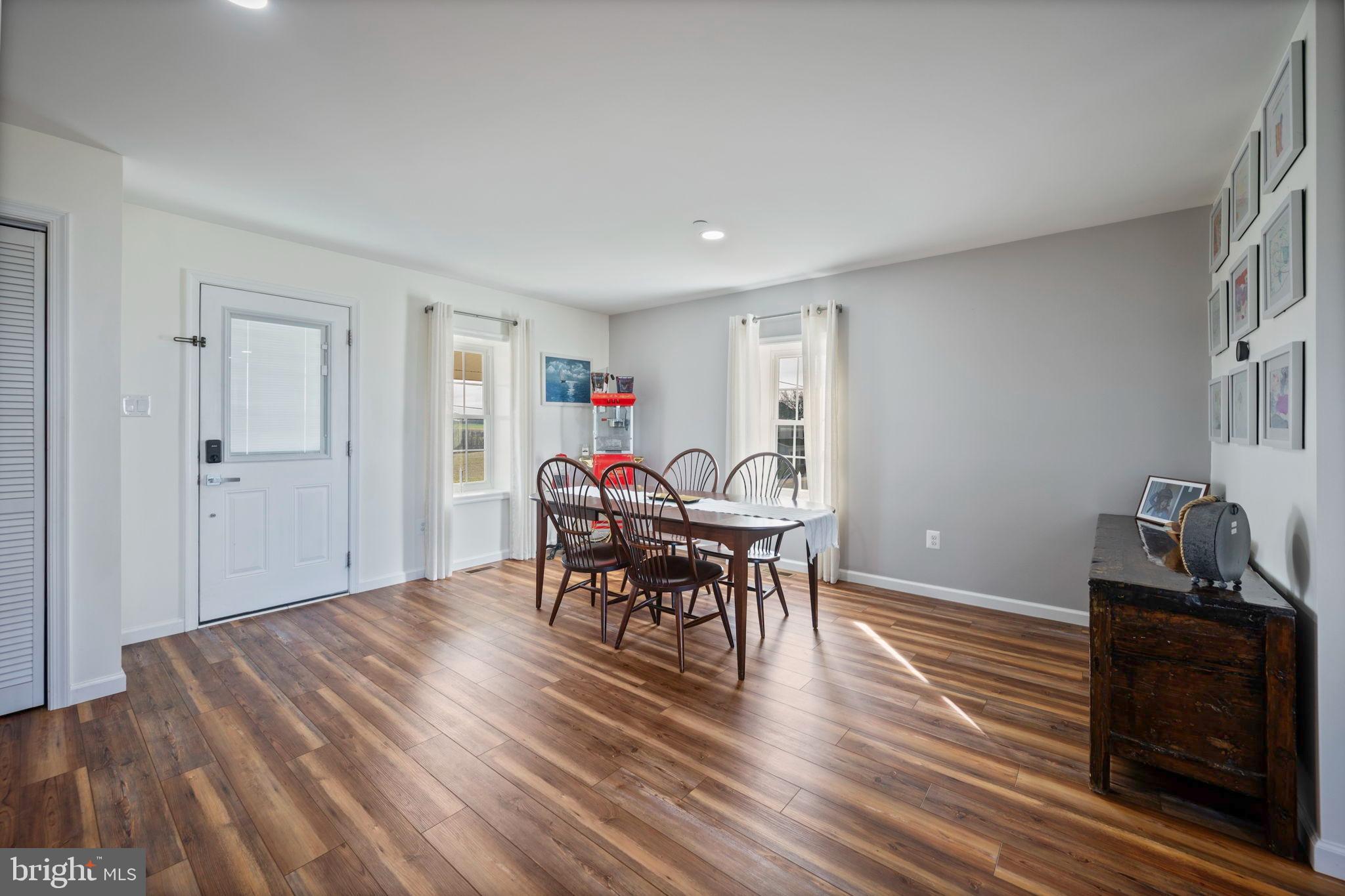 118 South Clear Ridge Road New Windsor, MD 21776 - Photo 5 of 43 a view of a dining room with furniture and wooden floor
