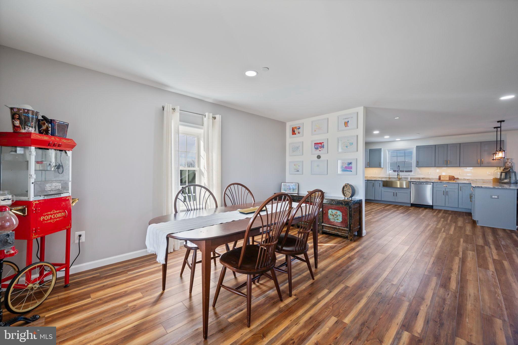 118 South Clear Ridge Road New Windsor, MD 21776 - Photo 7 of 43 a view of a dining room with furniture and wooden floor
