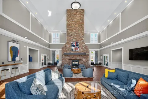a living room with fireplace furniture and a fireplace