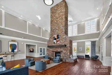 a living room with furniture fireplace and flat screen tv