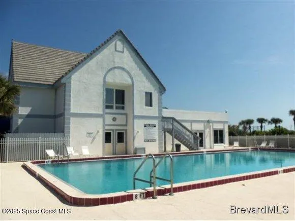 a view of a house with swimming pool