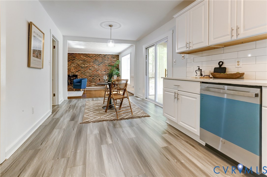 661 Greencastle Road Chesterfield, VA 23236 - Photo 9 of 28 a kitchen with granite countertop wooden floors and white stainless steel appliances