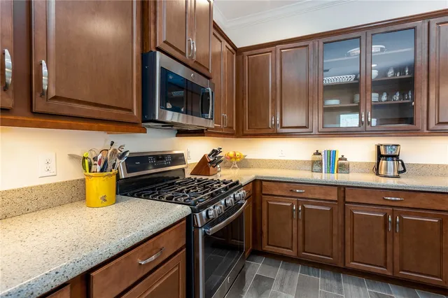 a view of a dining room with furniture and a potted plant