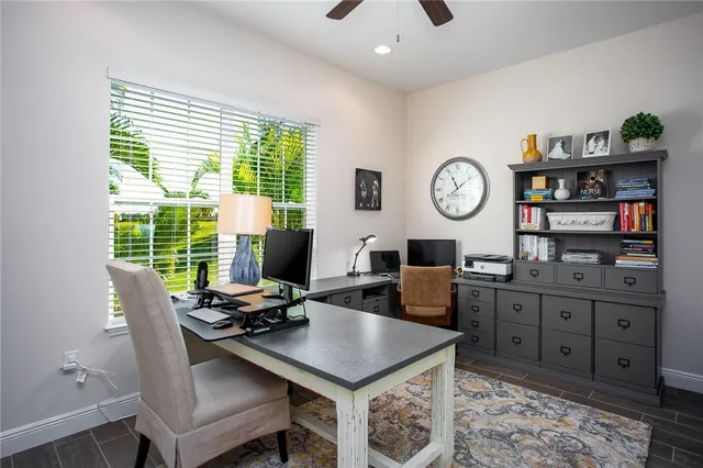 a bed sitting in a bedroom and night stand