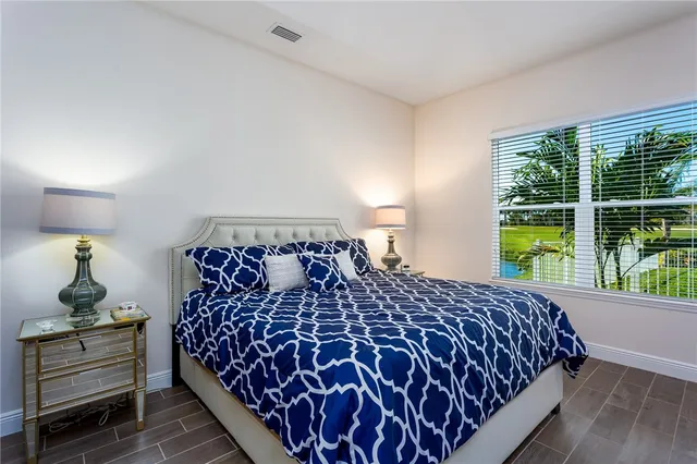 a bathroom with a tub a sink and mirror
