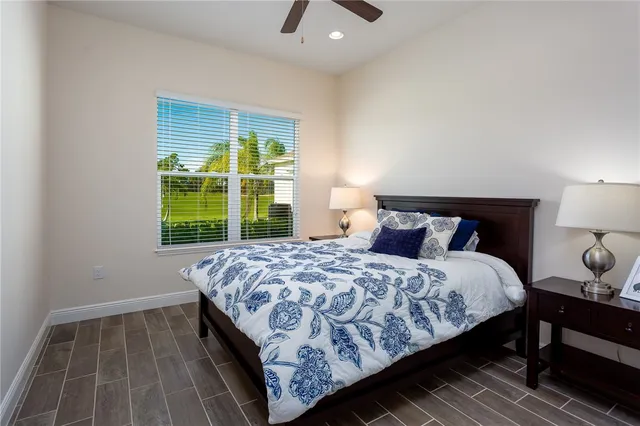 a bedroom with a bed and a tv