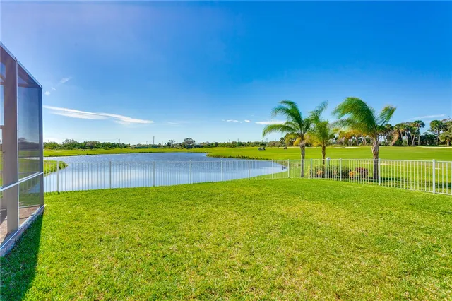 a view of a house with a garden and yard