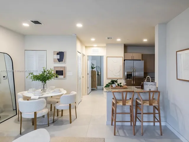 a view of a dining room with furniture
