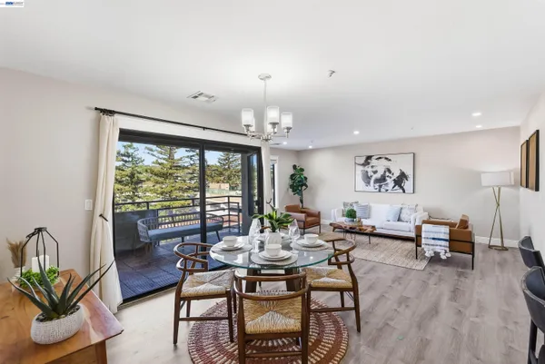 a view of a dining room with furniture window and outside view