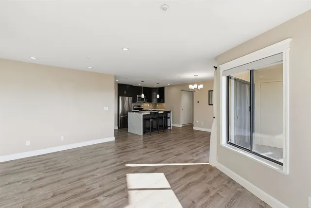 a view of a living room with a sink and a large mirror