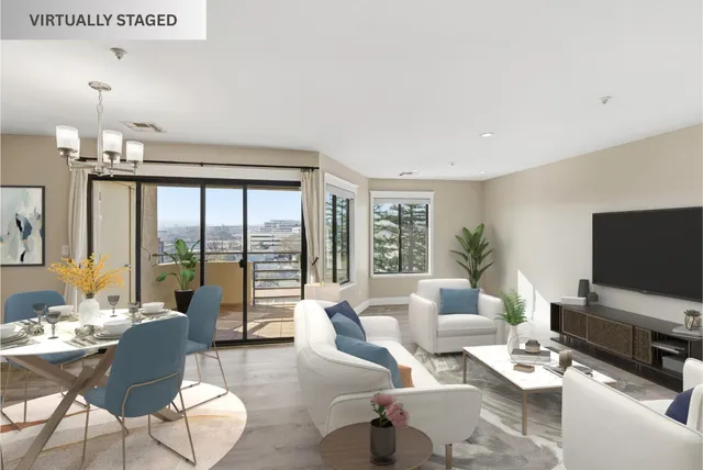 a living room with furniture a flat screen tv and a large window