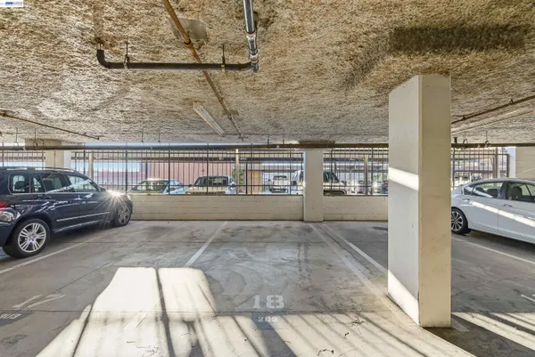 a view of kitchen with refrigerator and workspace
