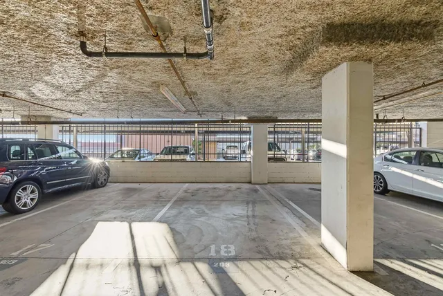 a view of kitchen with refrigerator and workspace