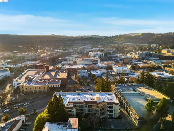 an aerial view of residential building and ocean