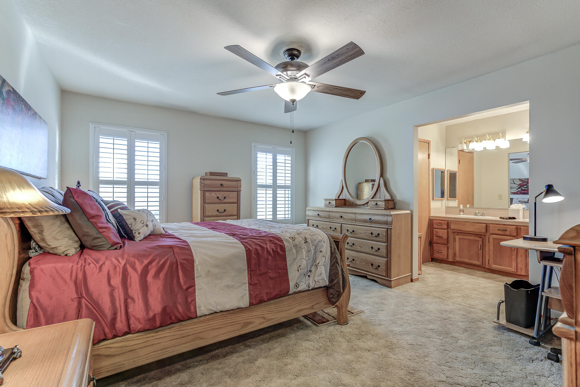 2730 Hall Road Corning, CA 96021 - Photo 15 of 52 a bed room with a bed and a chandelier