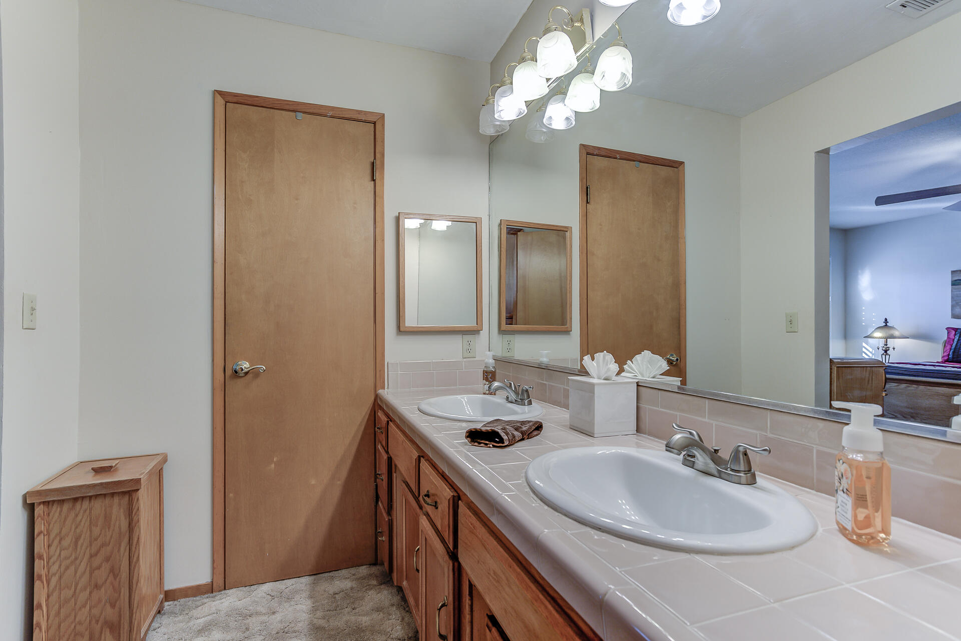 2730 Hall Road Corning, CA 96021 - Photo 17 of 52 a bathroom with a double vanity sink and a mirror
