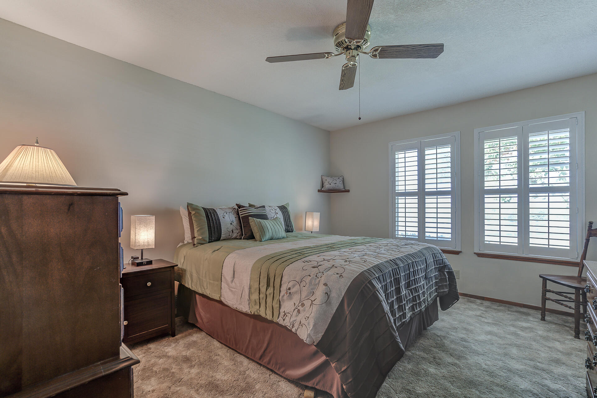 2730 Hall Road Corning, CA 96021 - Photo 18 of 52 a spacious bedroom with a bed and a table